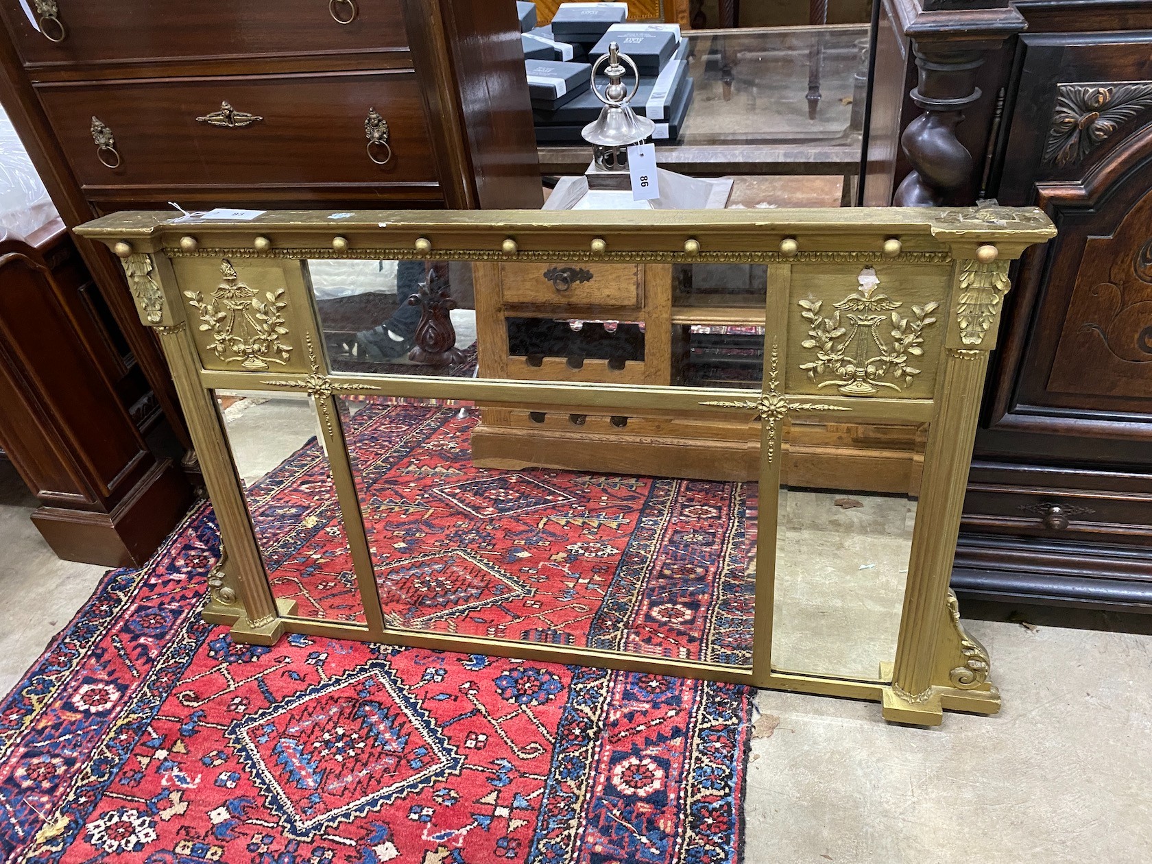 A 19th century giltwood and composition overmantel mirror, later painted, width 111cm, height 70cm